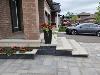 Front entrance with interlock steps and a seamless walkway design for a grand entryway.