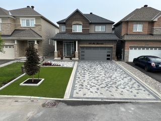 New Interlock driveway with new polymeric sand installation, ensuring stable and weed-free joints