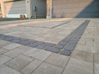 Elegant interlock driveway with expertly laid pavers, designed for long-lasting strength and aesthetics.