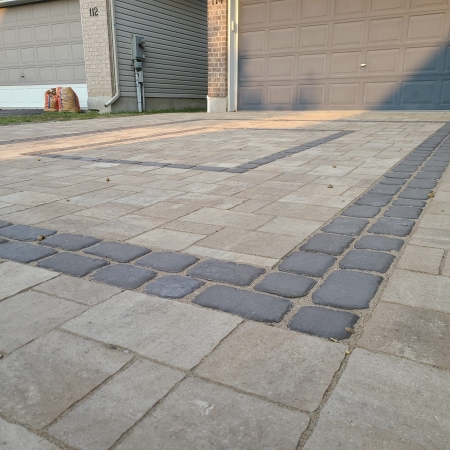 Elegant interlock driveway with expertly laid pavers, designed for long-lasting strength and aesthetics.
