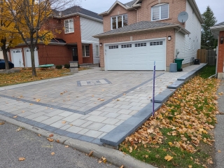 Brand new interlock driveway with modern paver design, enhancing curb appeal and durability.