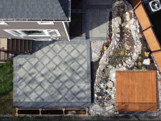 Custom-designed interlocking stone patio with a bold border accent