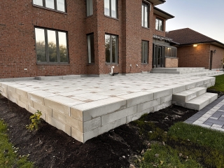 Raised Patio by RIVERMIST using Techo-Bloc product Blu Grande