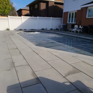 Beautiful pool patio with slip-resistant interlocking pavers for a stylish and safe outdoor space