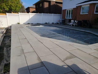 Beautiful pool patio with slip-resistant interlocking pavers for a stylish and safe outdoor space